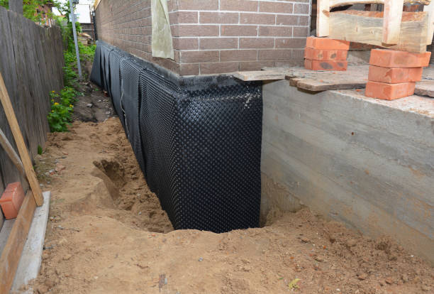 Happy homeowners after waterproofing job in Pine Village